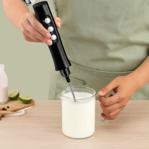 Person Using Black Milk Frother in Action